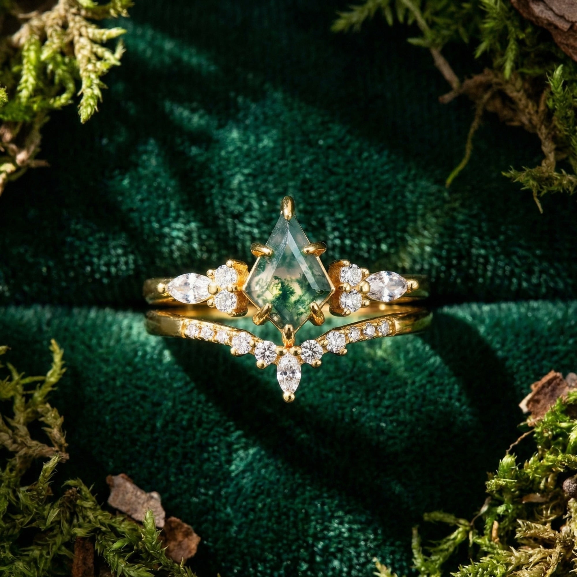 Kite-cut moss agate duo ring set in gold-plated sterling silver on green velvet with natural moss accents.