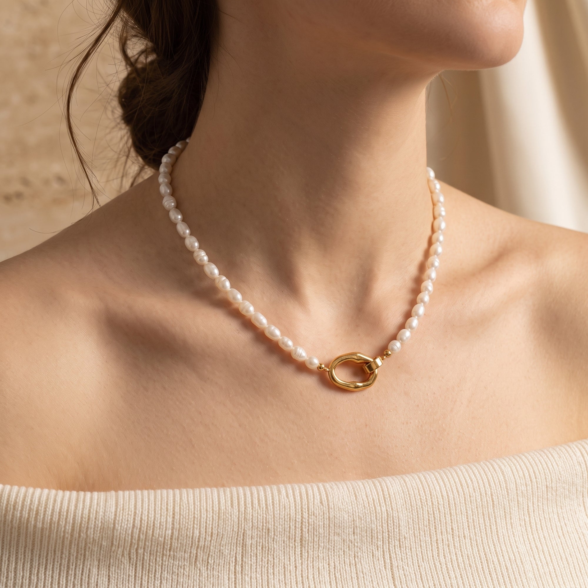 Model wearing Audrielle 18K gold PVD necklace with white rice pearls.