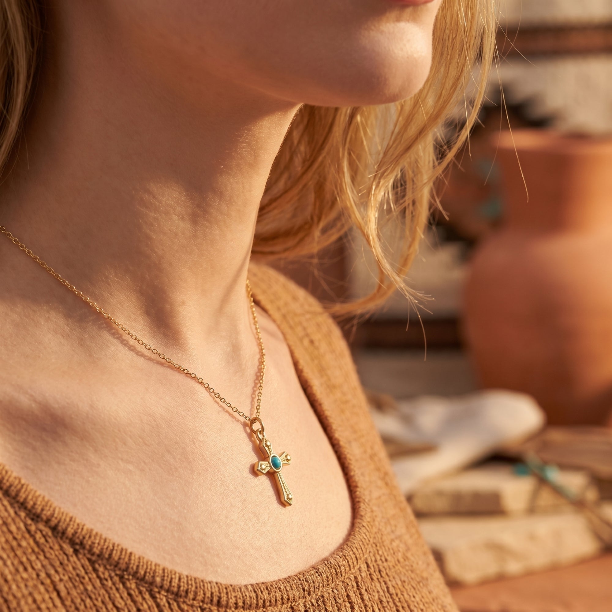 Bohemian 18K gold finish turquoise cross necklace worn by a model, highlighting its everyday aesthetic.