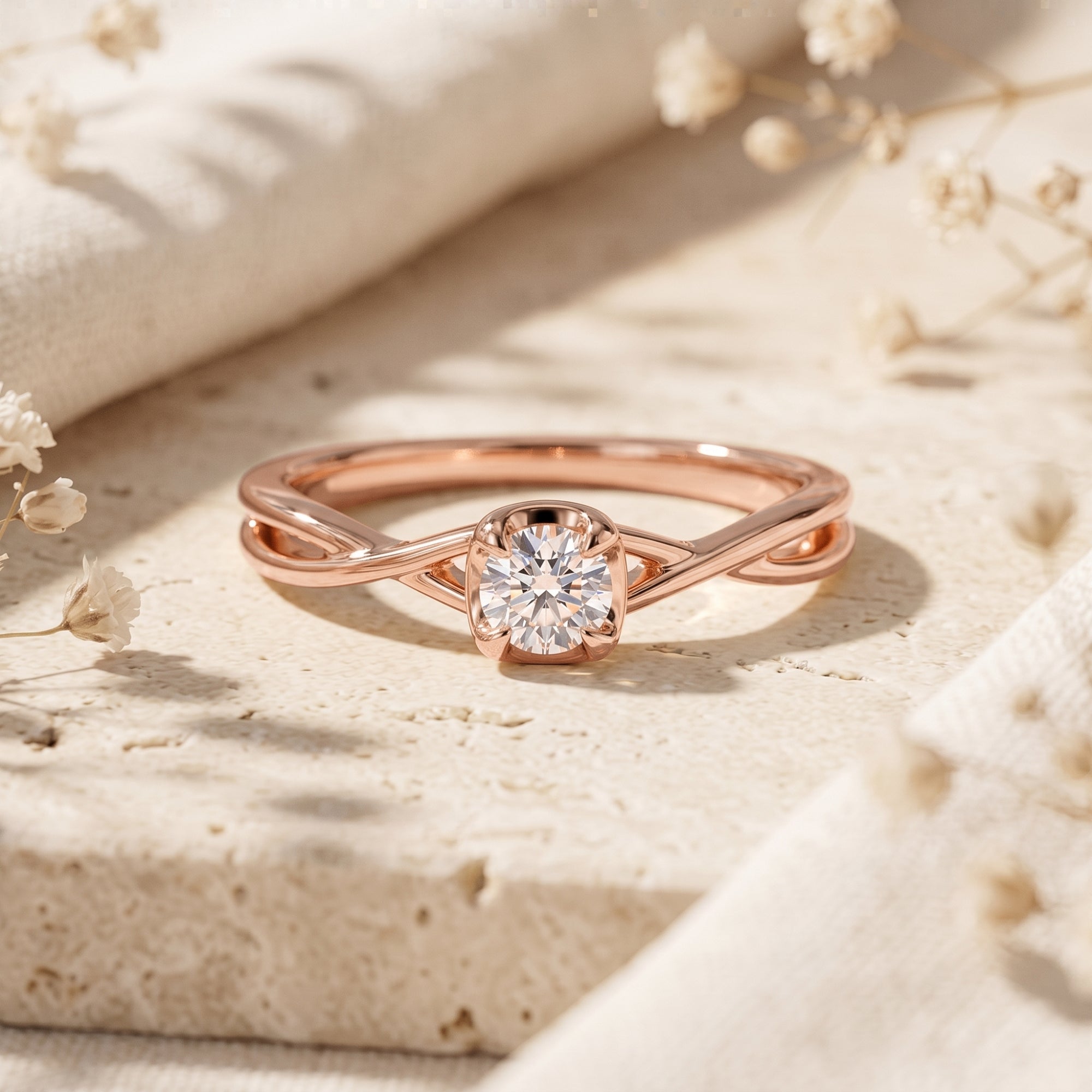 Rose gold promise ring with a 1ct round cut moissanite center stone displayed on a stone surface.