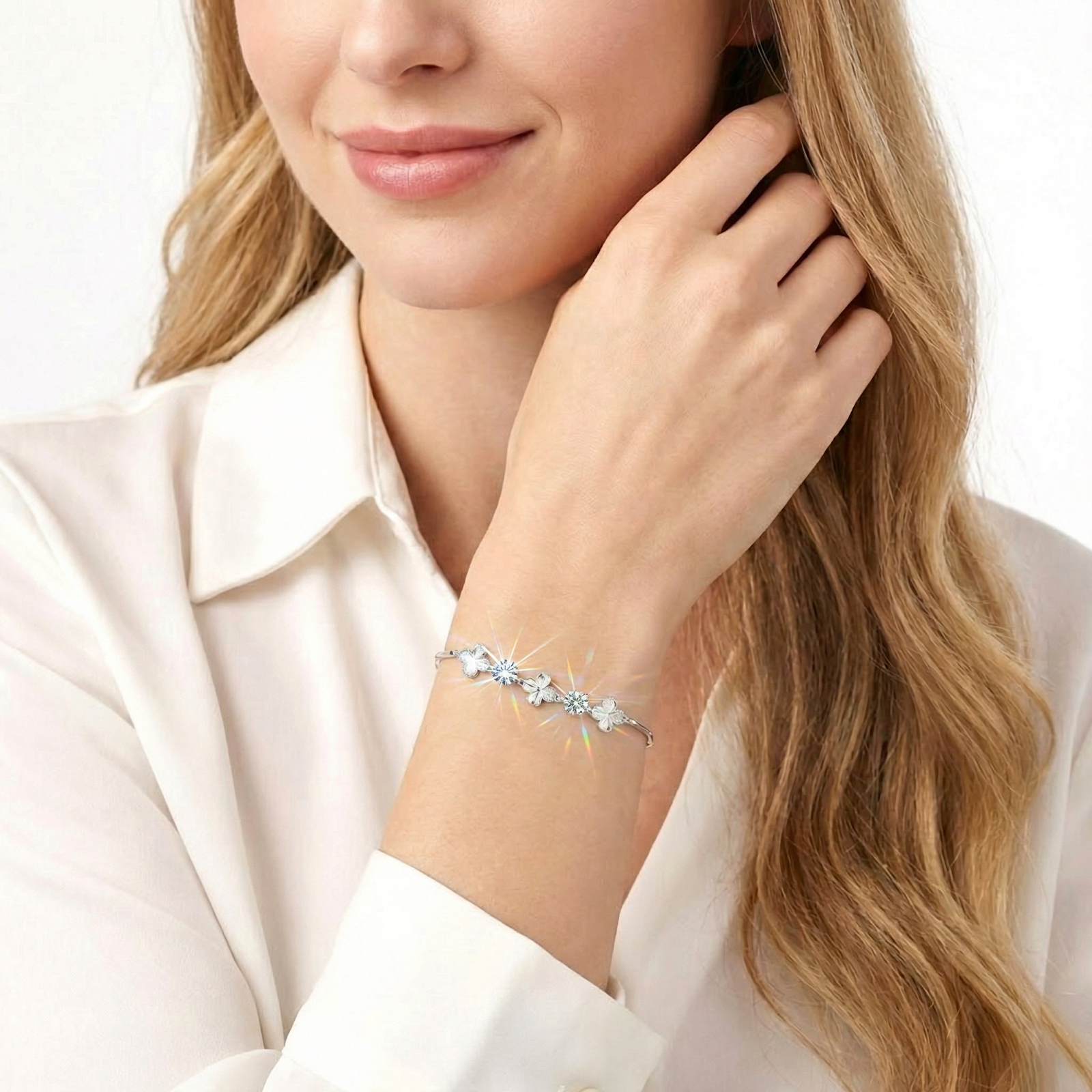 Woman wearing the S925 sterling silver clover bracelet with sparkling round-cut simulated diamonds on her wrist.