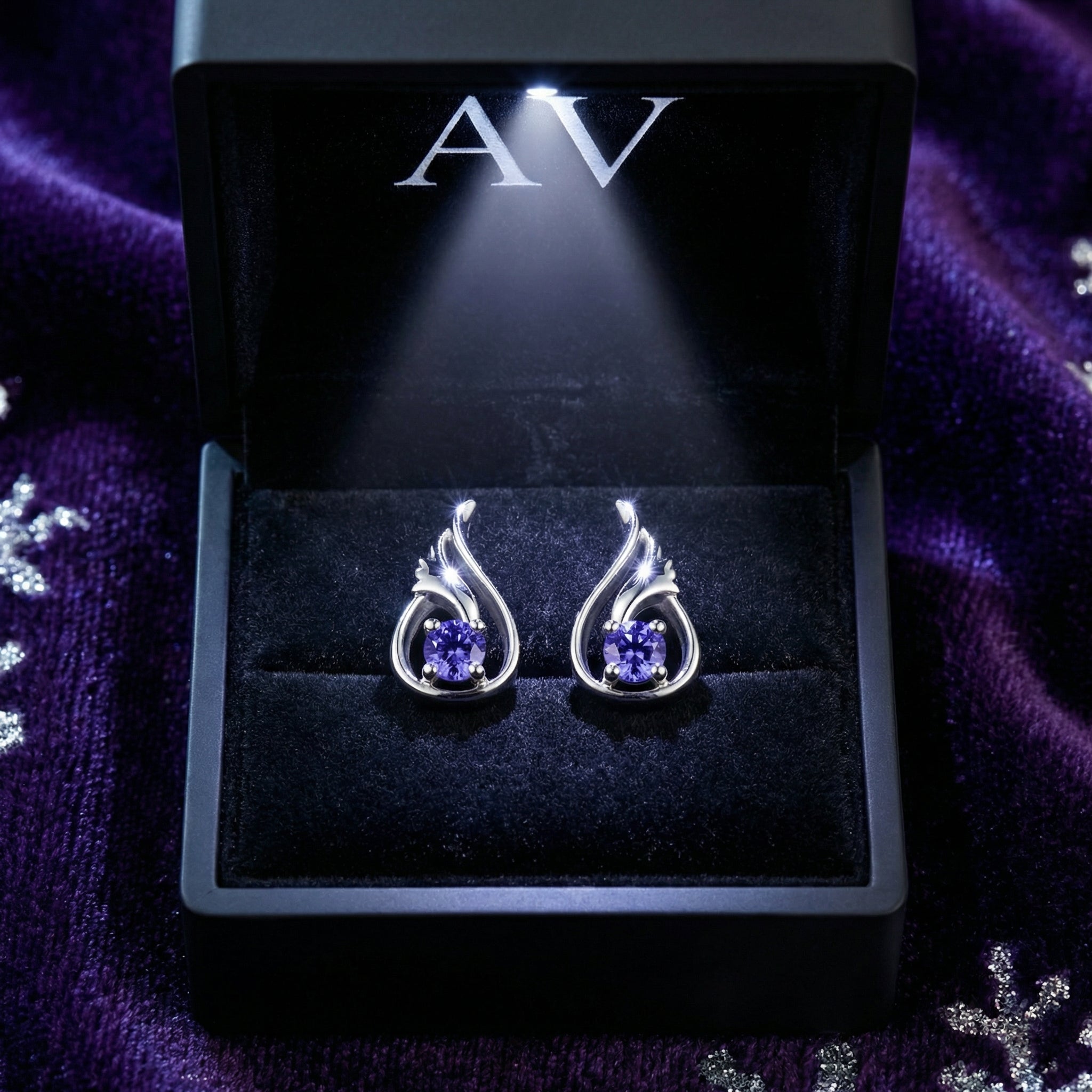 Sterling silver Florisara Bud simulated tanzanite earrings presented in a lighted black AV branded jewelry box.