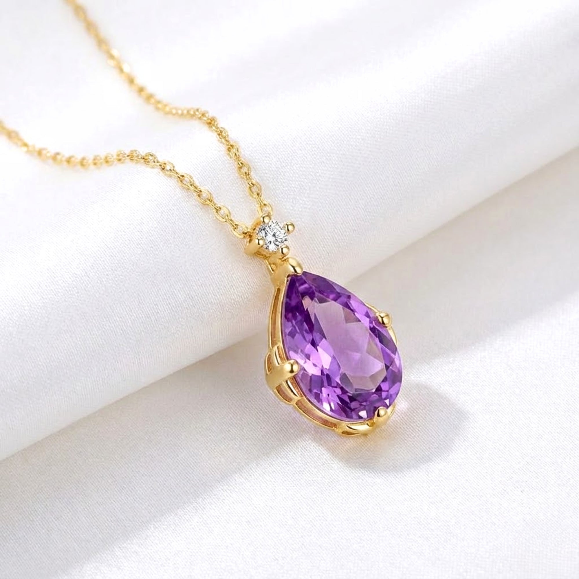 Close-up of a pear-cut simulated amethyst necklace pendant in an 18K gold vermeil setting.