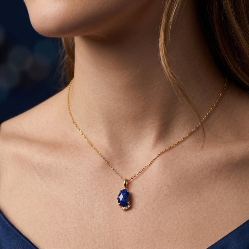 Model wearing the Maia pear natural lapis lazuli pendant necklace in 18k gold plated sterling silver.