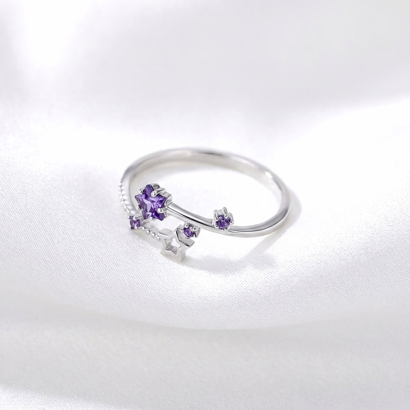 Top view of the adjustable S925 sterling silver Galaxia ring with star-cut purple simulated amethyst.