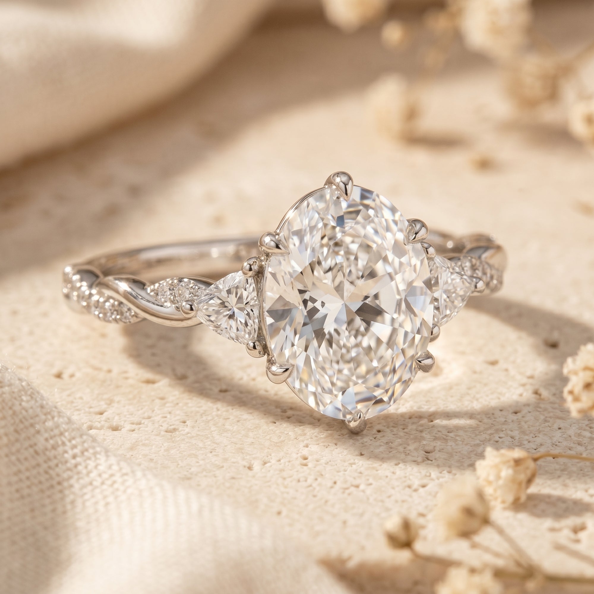 Macro view of the Amalthea silver ring featuring a twisted band and 3-carat oval moissanite.