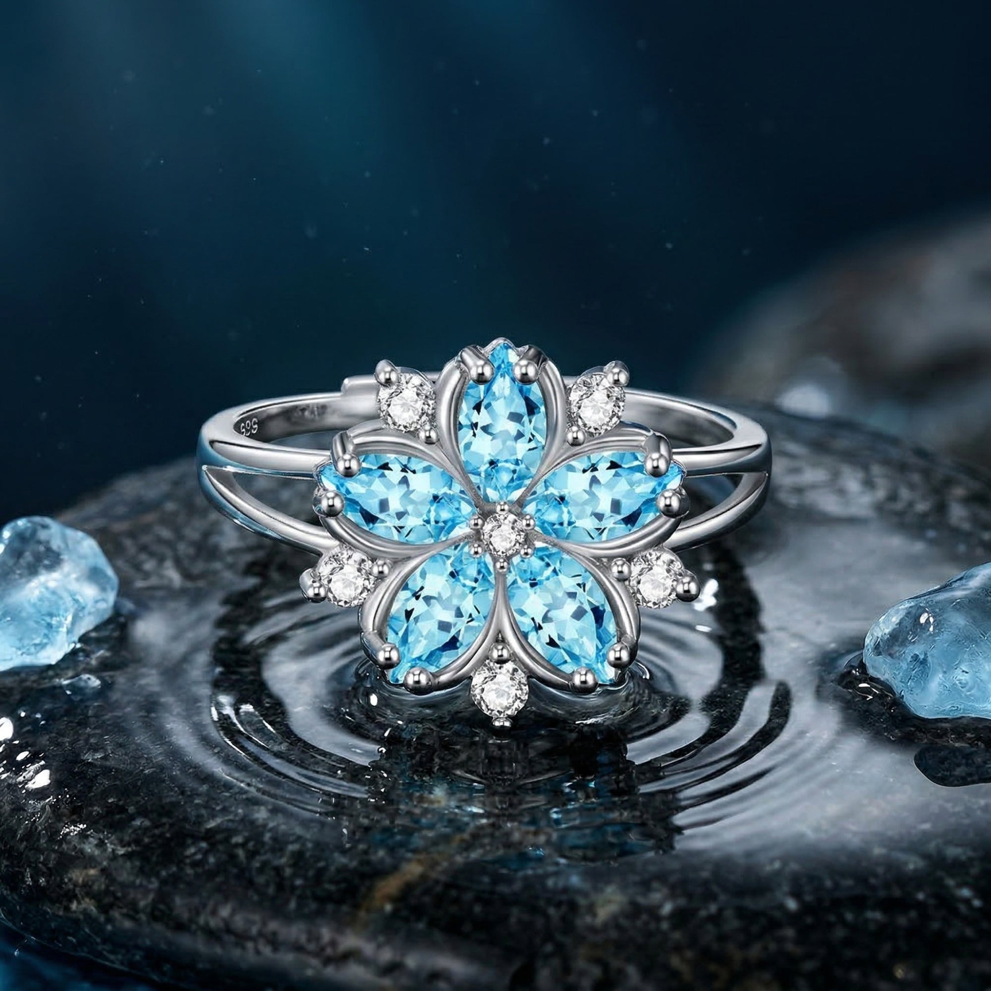 Close-up of the Undine Blossom ring featuring marquise-cut aquamarine petals in a sterling silver floral setting.