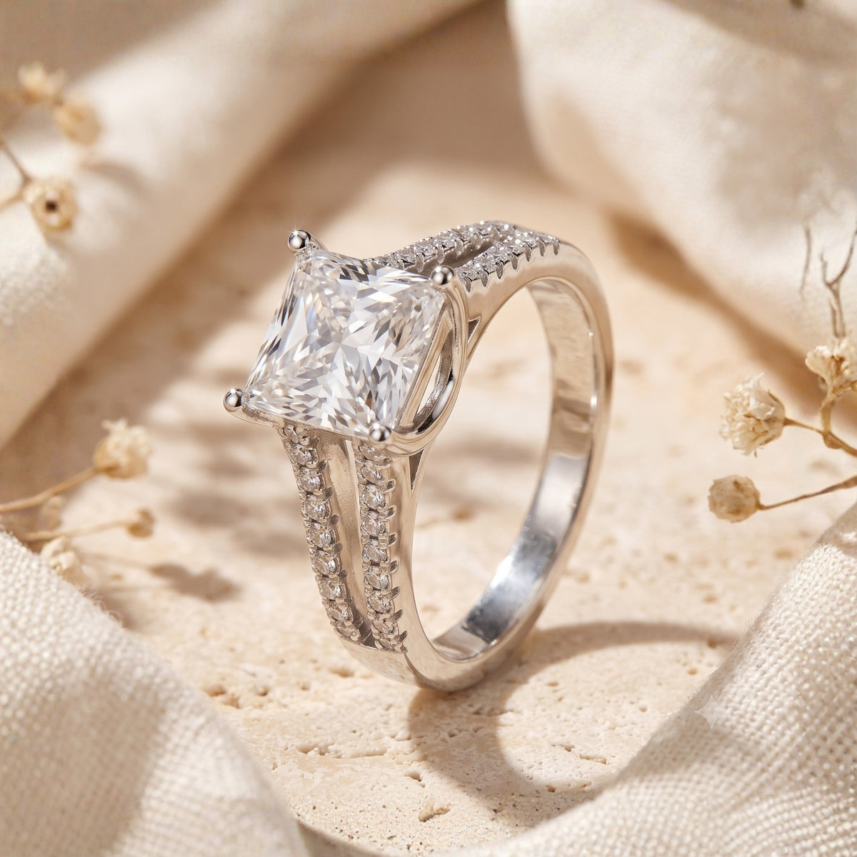 Side-angled view of the silver ring showing the split-shank pave band and elevated prong setting.