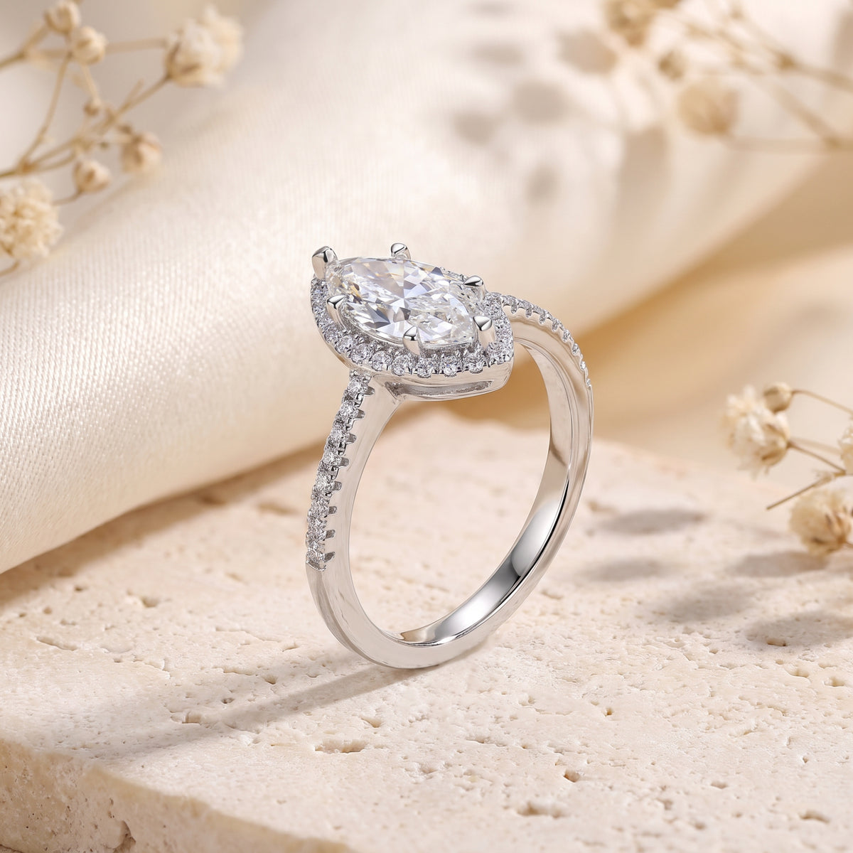 Side profile of the S925 sterling silver marquise halo ring showing the prong setting and micro-pavé band.