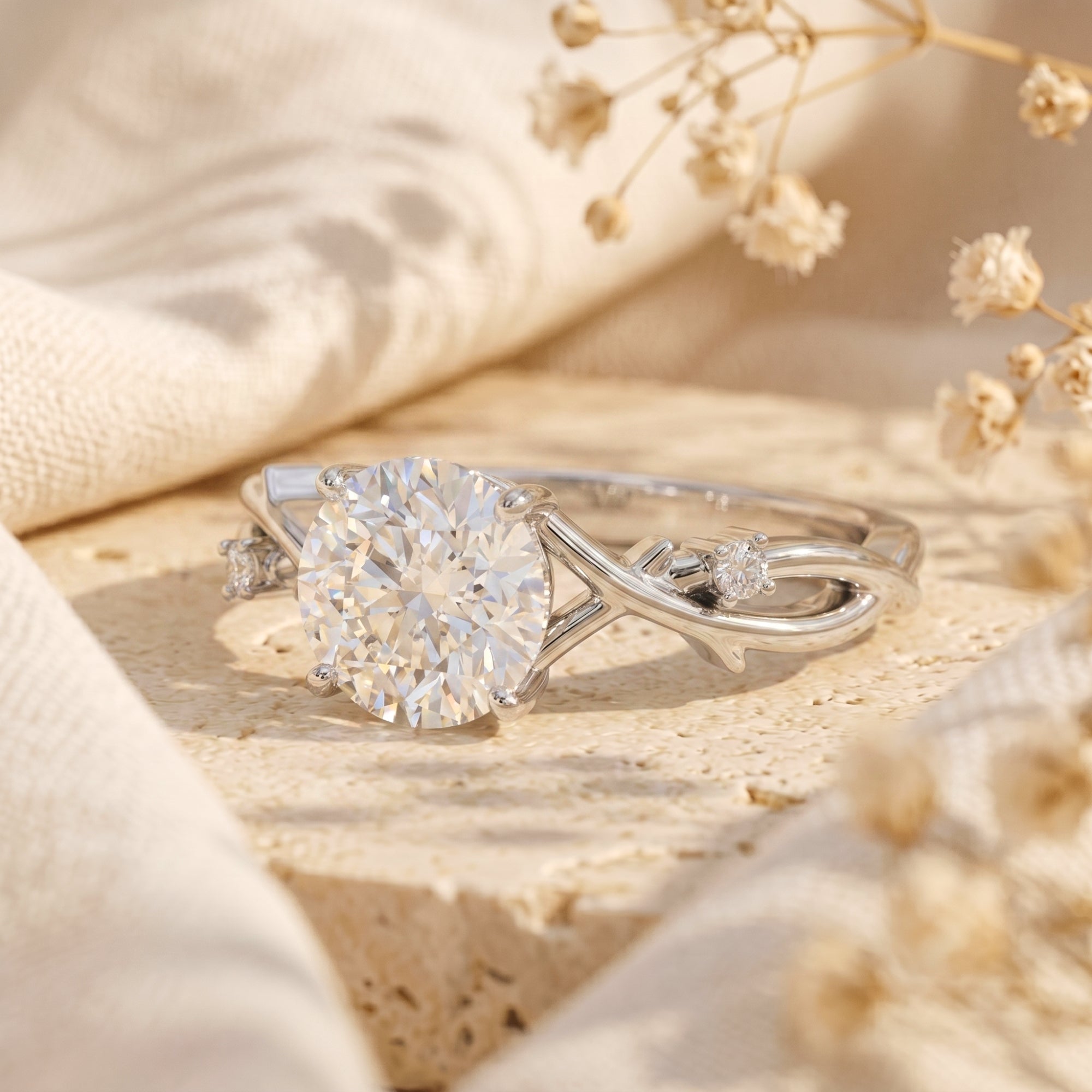 Side view of the Sylvella moissanite engagement ring in silver showing the intricate vine-like band.