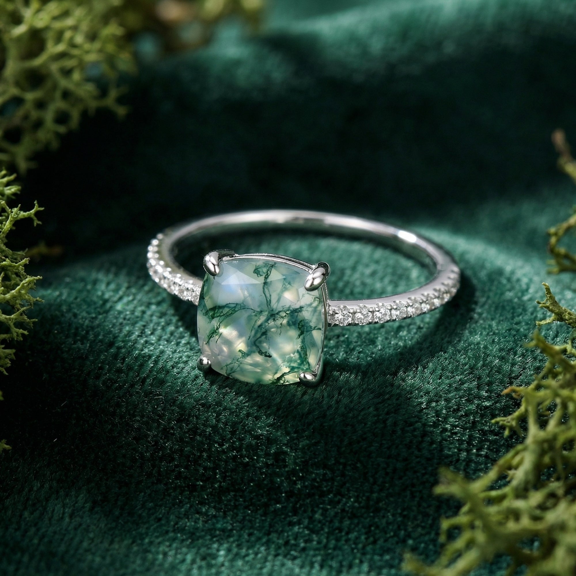 Close-up of the cushion cut moss agate stone and pavé setting on an S925 sterling silver ring.
