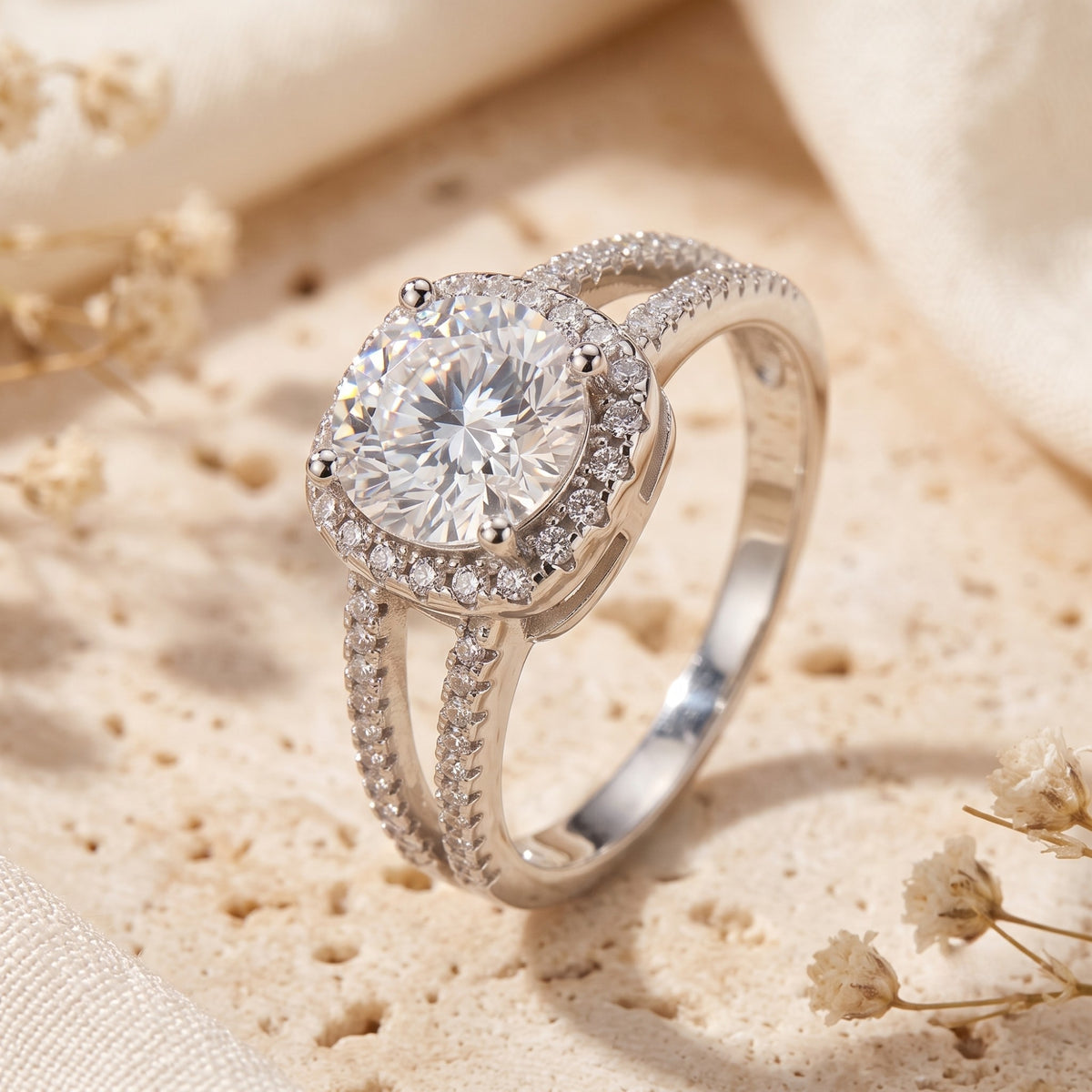 Three-quarter view of the silver ring showcasing its pave split shank and elevated halo setting.
