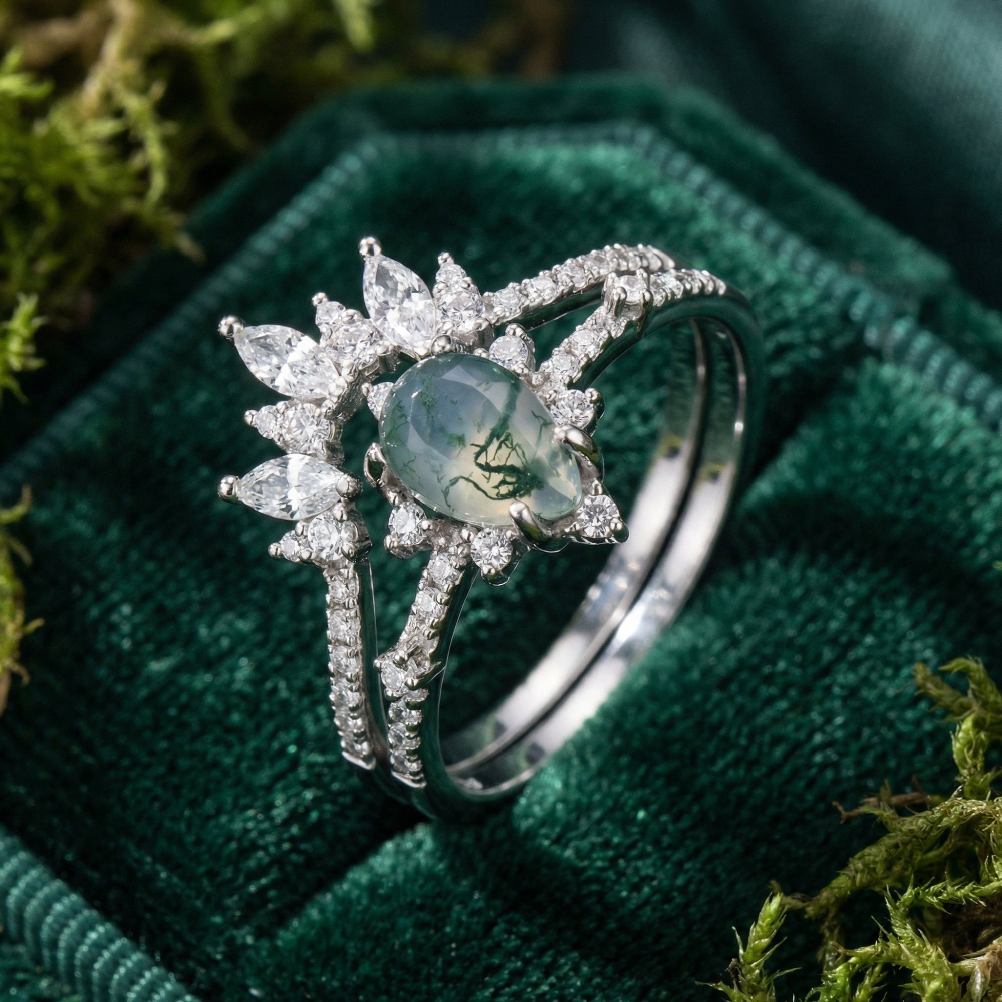 Macro shot of the frosted kite cut moss agate stone and marquise diamond accents in a silver setting.