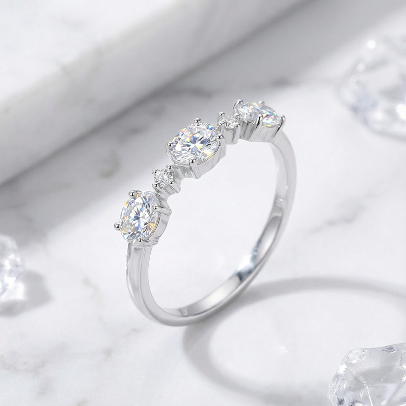 Side view of the Elianne sterling silver ring showing round cut zirconia stones in a low-profile prong setting.