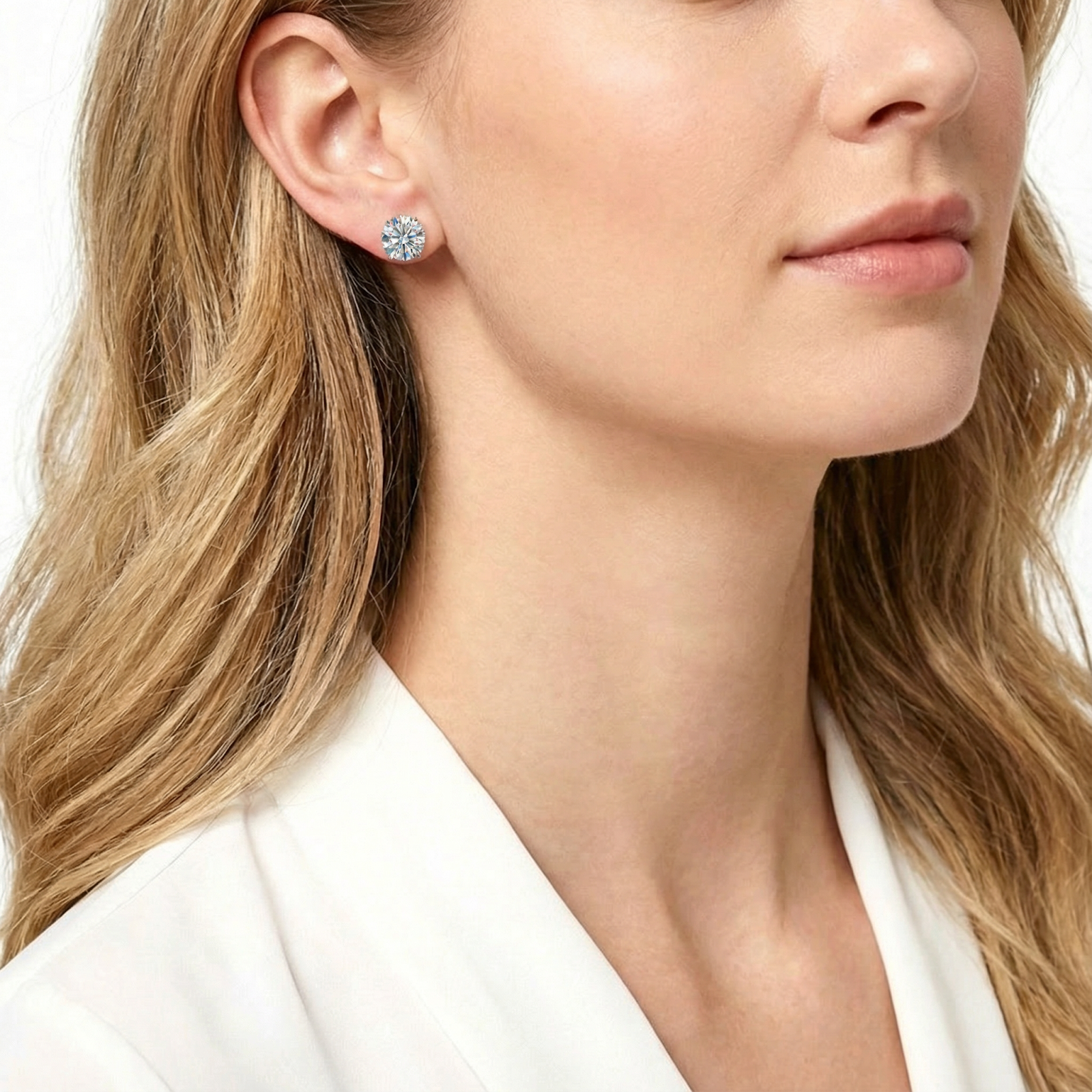 Side view of a model wearing the Valia oval cut zirconia stud earring in silver sterling silver.