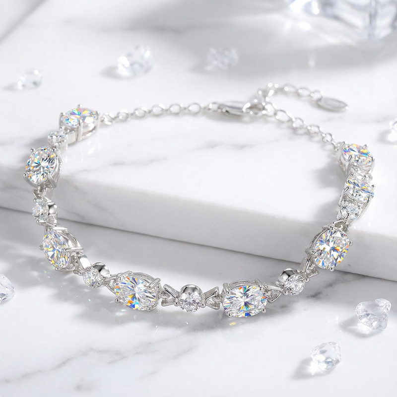 Close-up of oval cut A5 zirconia stones in a rhodium-plated sterling silver bracelet setting.