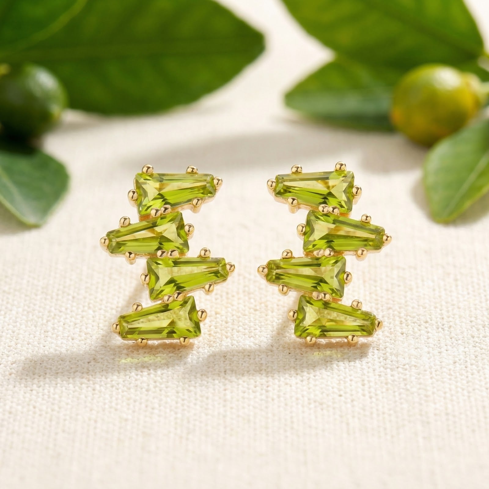 Front view of Zephyraea Vine earrings in 18K gold vermeil featuring precision-cut simulated peridot stones.