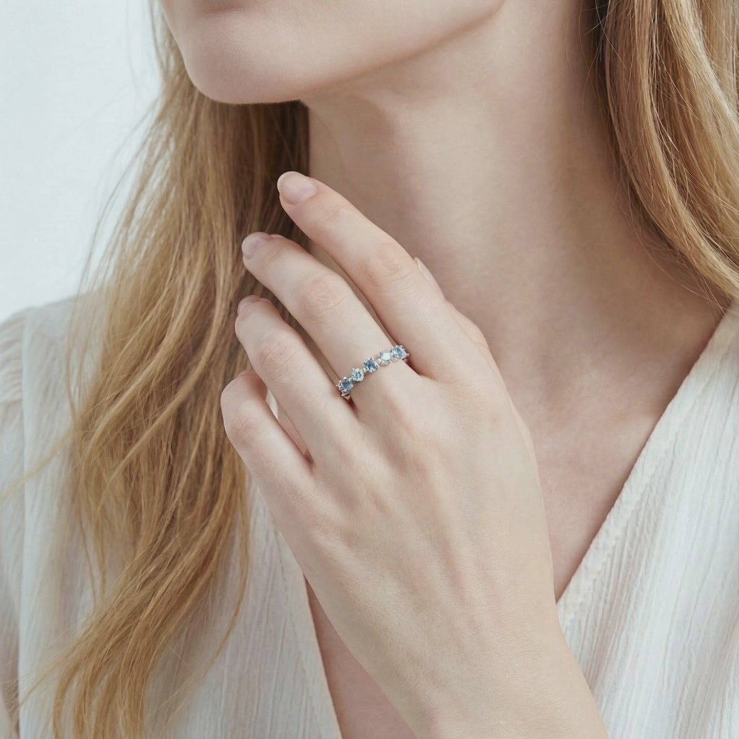 Solid gold ring with simulated aquamarine stones.