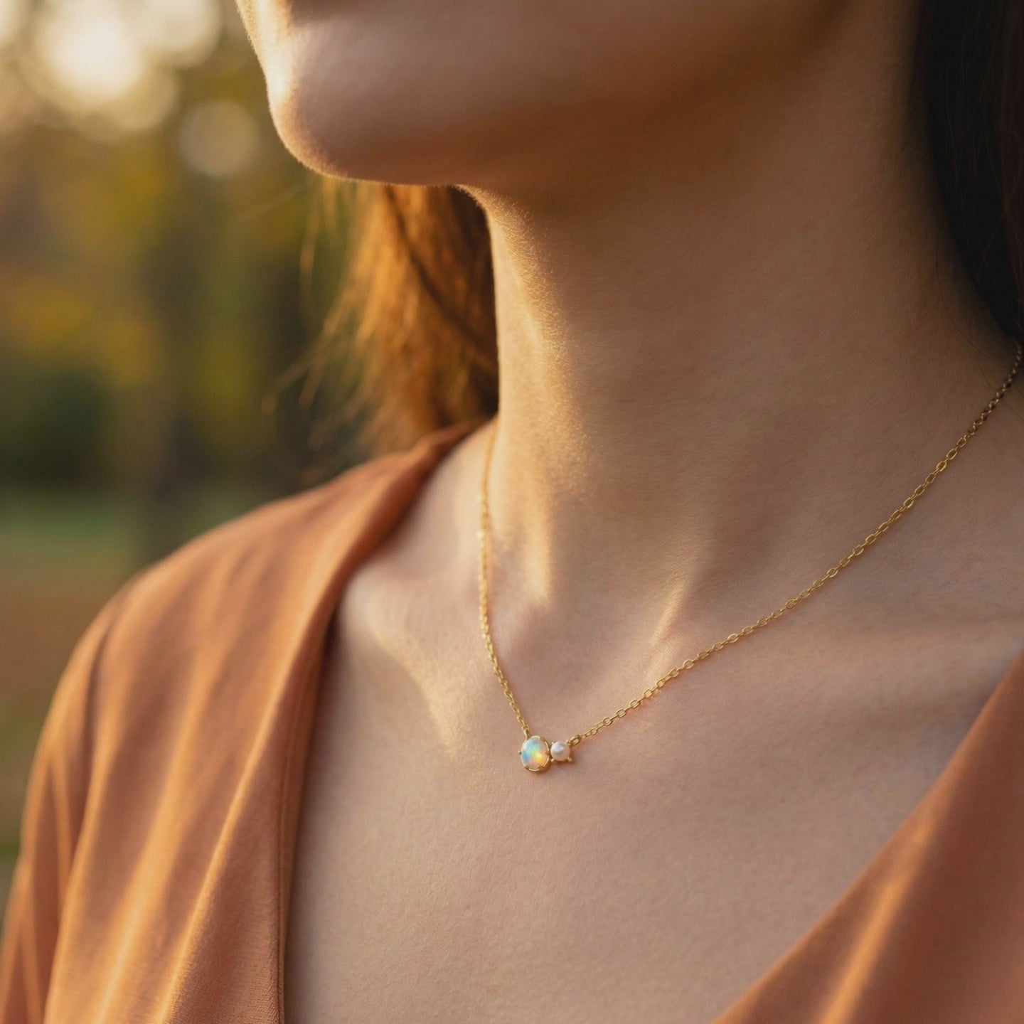 Lumira oval white opal necklace in solid gold.