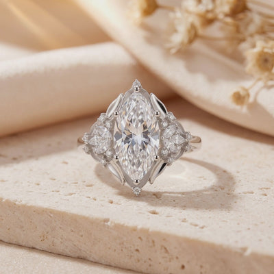 Close-up of the silver Thara Ring showing its marquise-cut center stone and surrounding cluster accents.