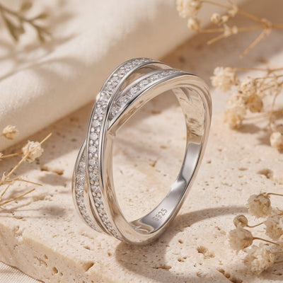 Close-up of the silver crossover pavé ring standing upright, showing the interior S925 stamp.