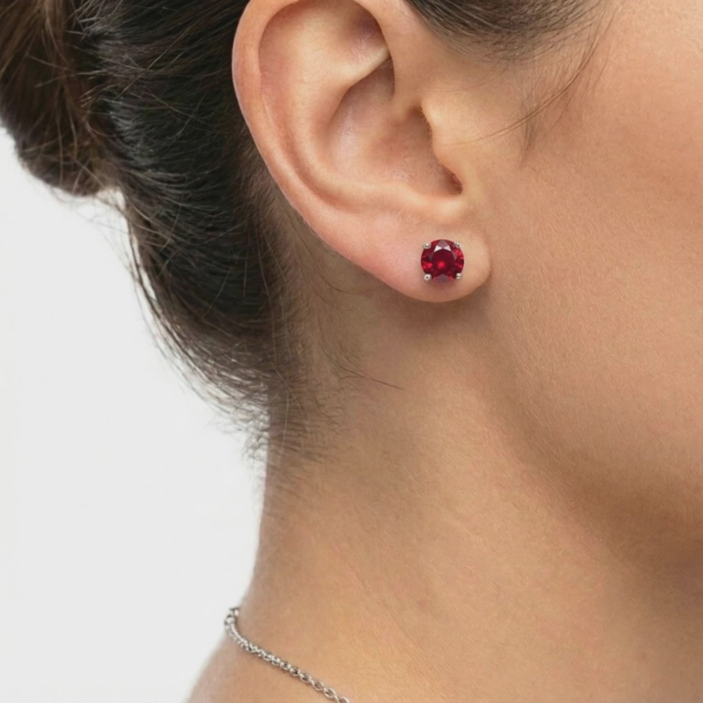 Simulated ruby stud earrings in solid gold.