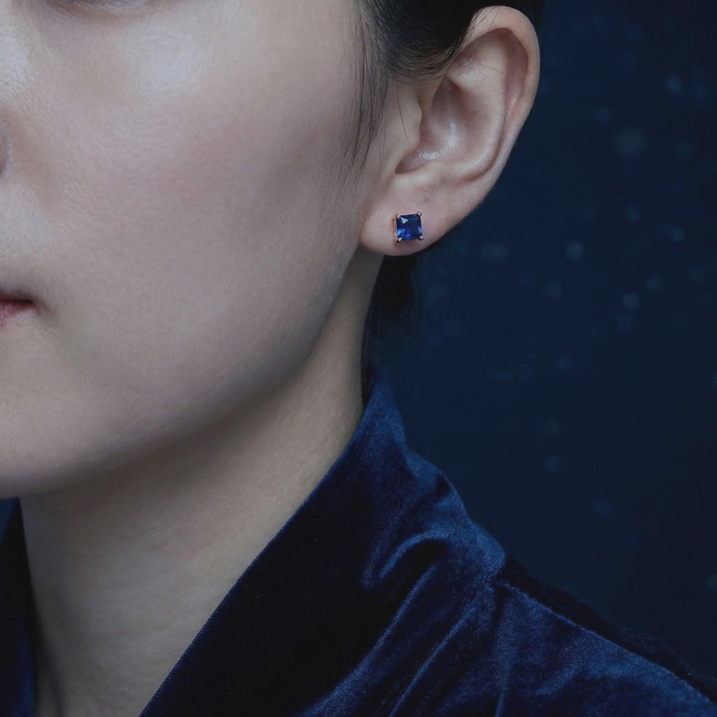 Square simulated sapphire stud earrings in solid gold.