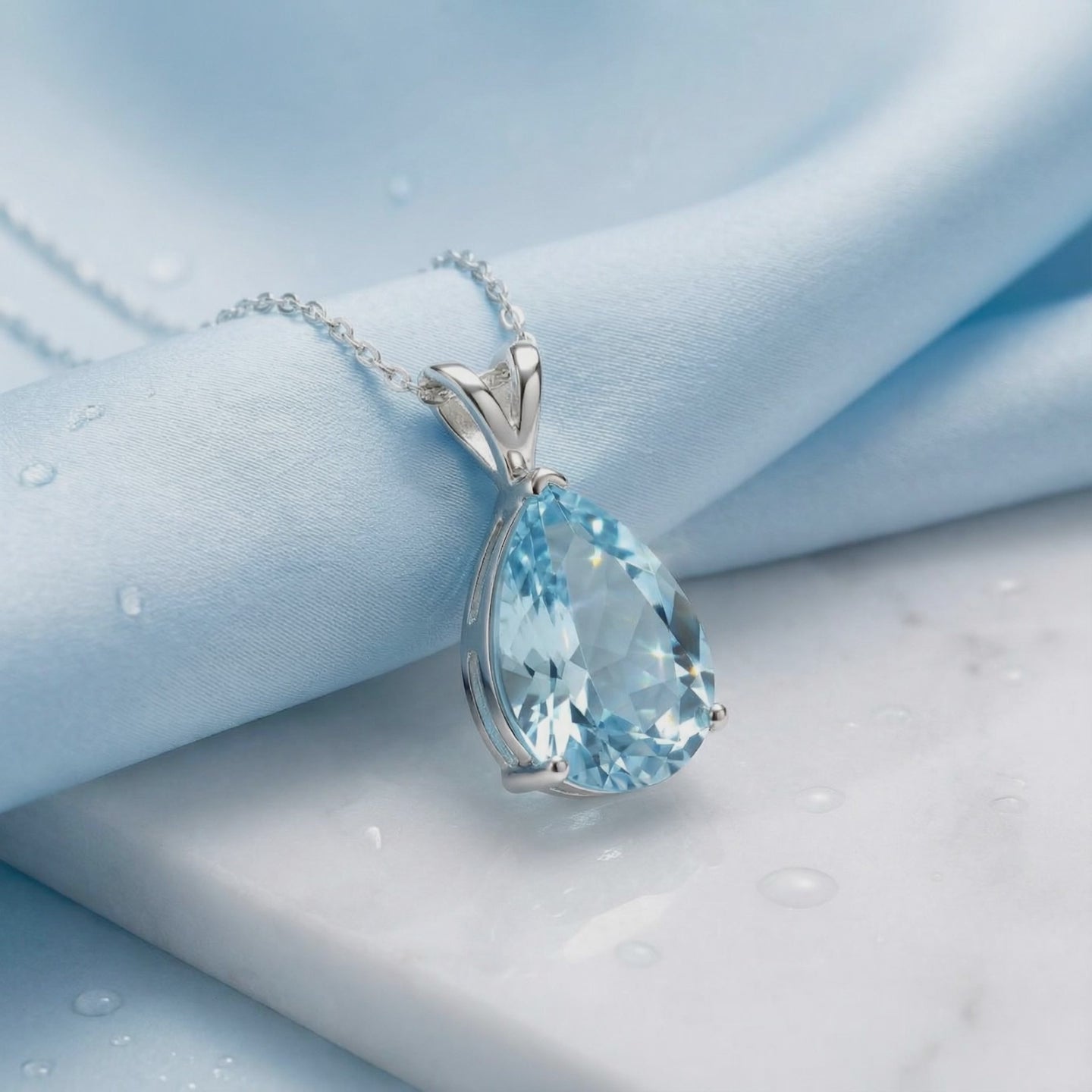 Simulated aquamarine necklace in solid gold.