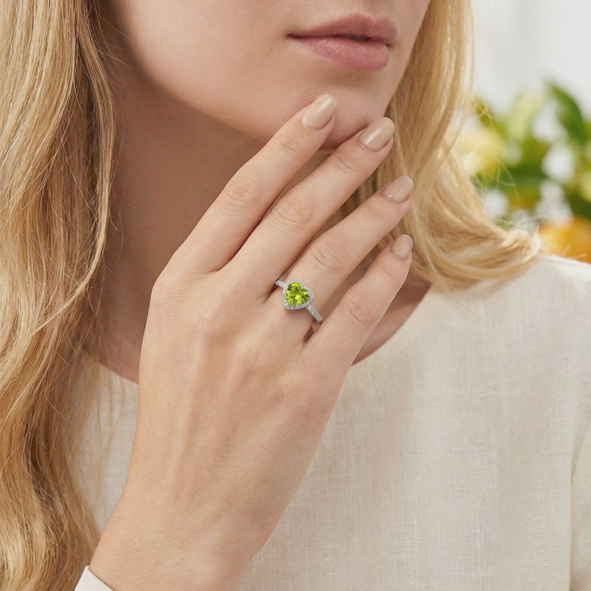Elianelle heart-cut simulated peridot ring in solid white gold featuring a heart-cut green gemstone.