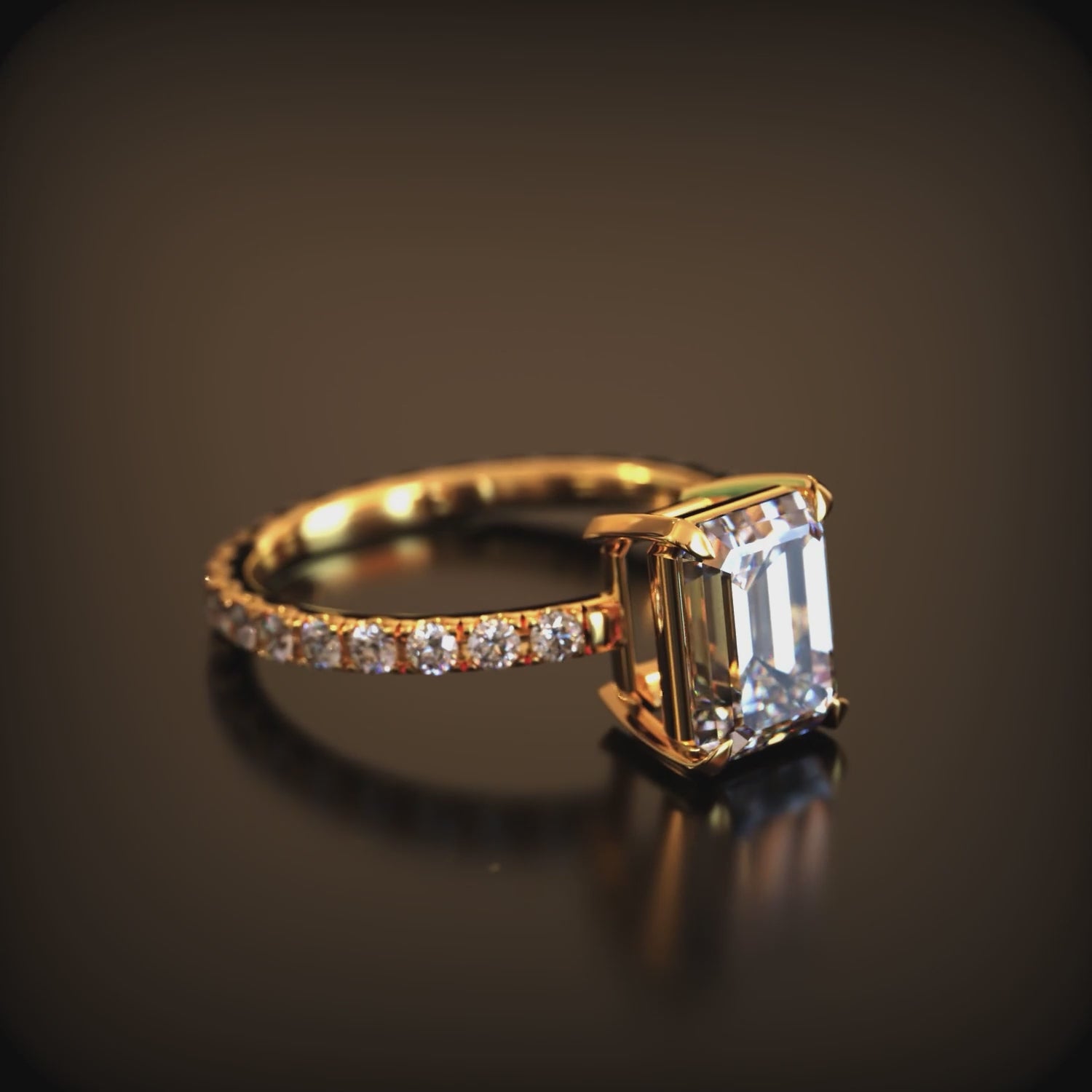 Video of The Cecily Jane solid gold ring with emerald-cut moissanite and accent stones
