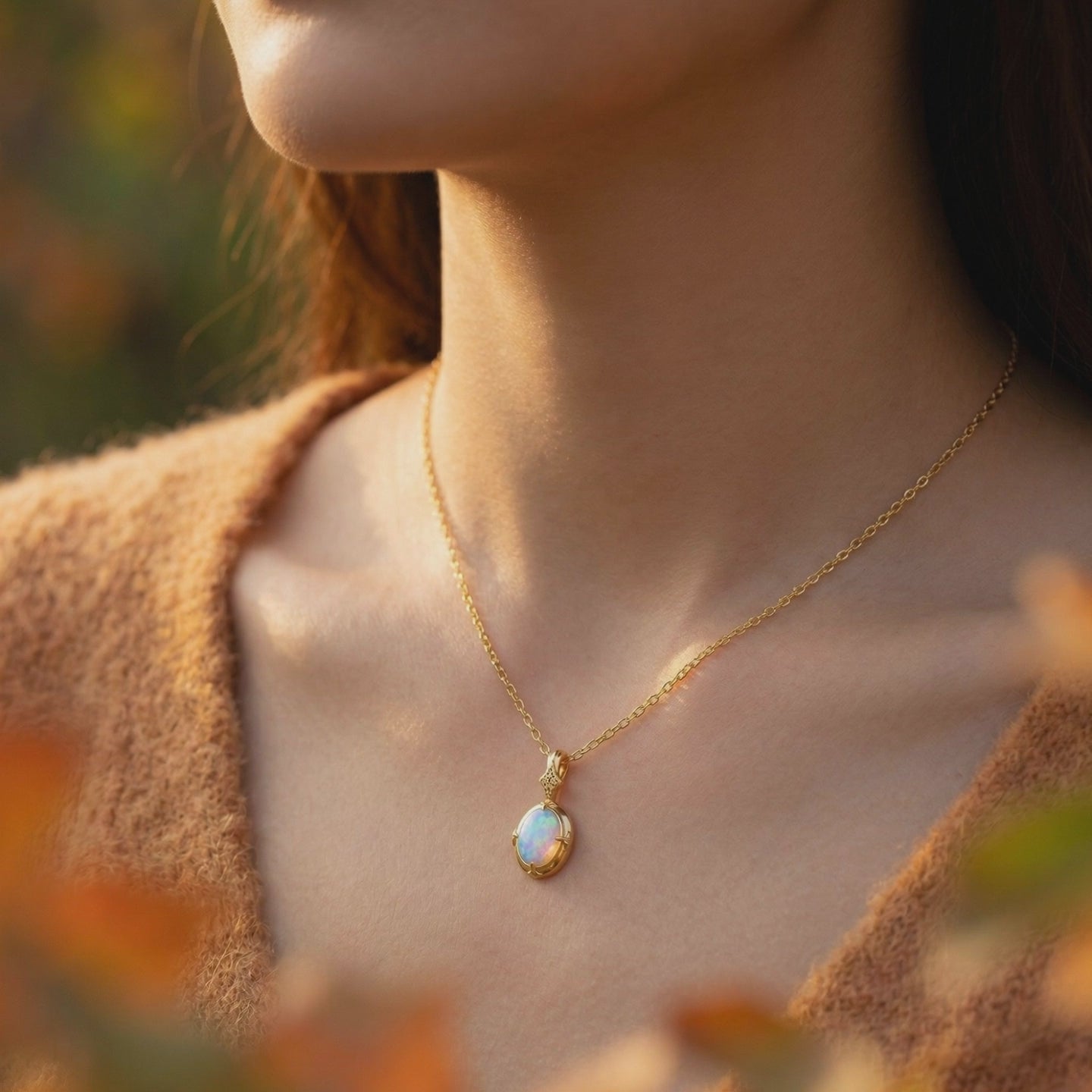 Natural white opal oval pendant necklace in solid gold.