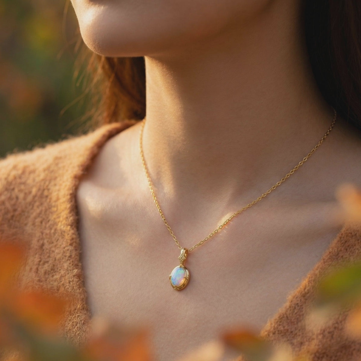 Natural white opal oval pendant necklace in solid gold.