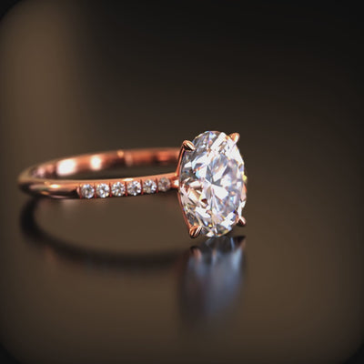 An oval moissanite solid gold ring.