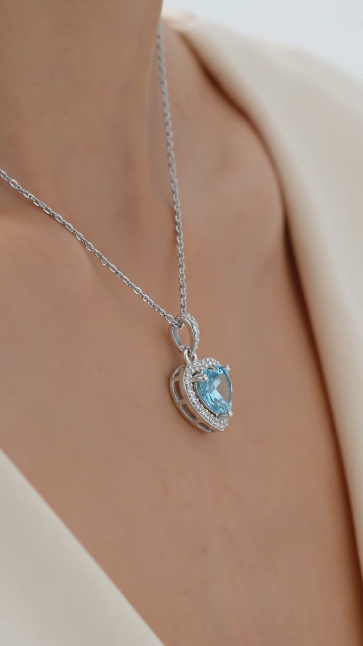 Simulated aquamarine heart pendant necklace in solid gold.