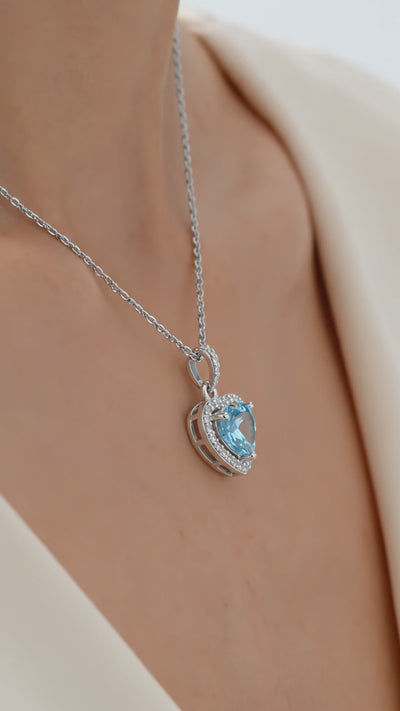 Simulated aquamarine heart pendant necklace in solid gold.