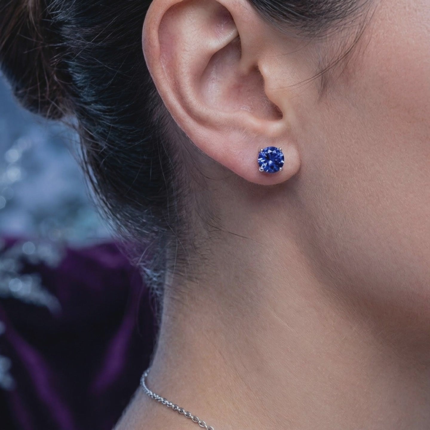 Simulated tanzanite stud earrings in solid gold.