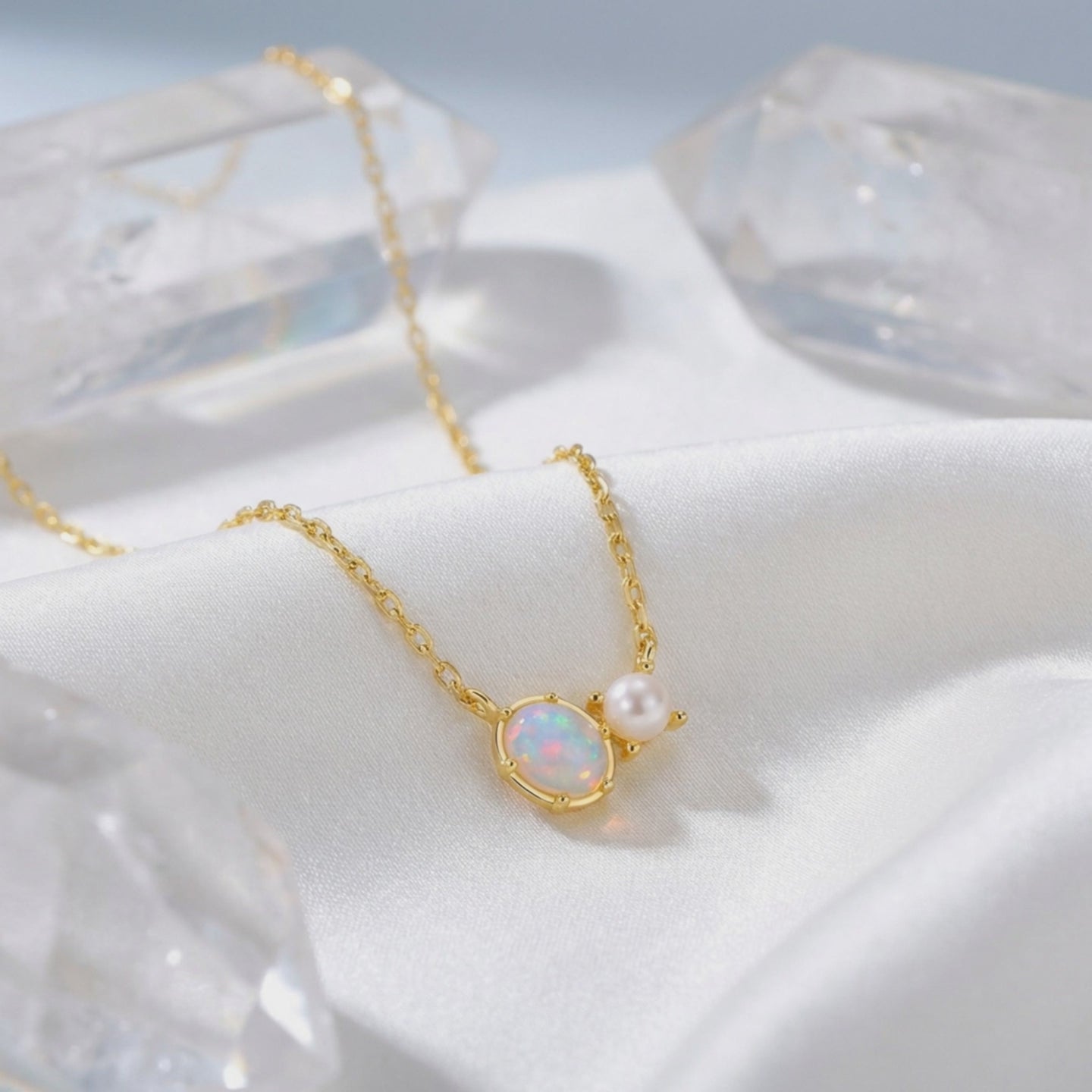 Lumira oval white opal necklace in solid gold.