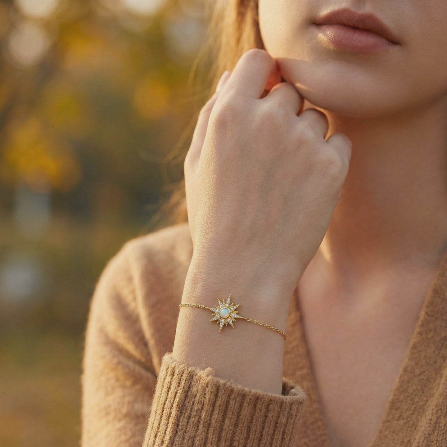 A solid gold tennis bracelet with natural white opals, showcasing its continuous design.