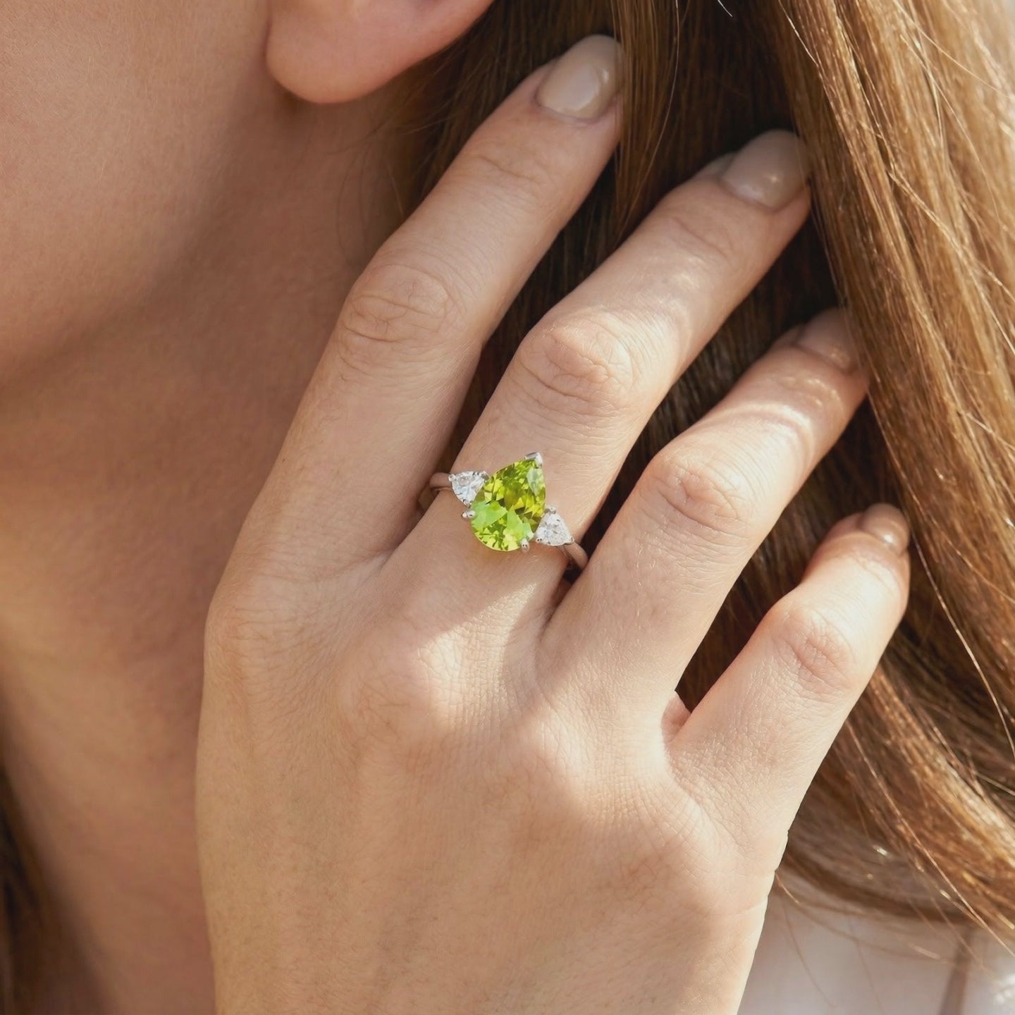 Solid gold ring with pear-cut simulated peridot.
